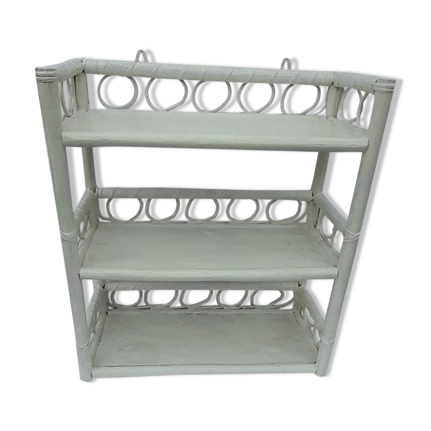 White rattan wall shelf