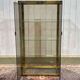 Exhibition showcase in gold-plated chrome and smoked glass - work from the 1980s.