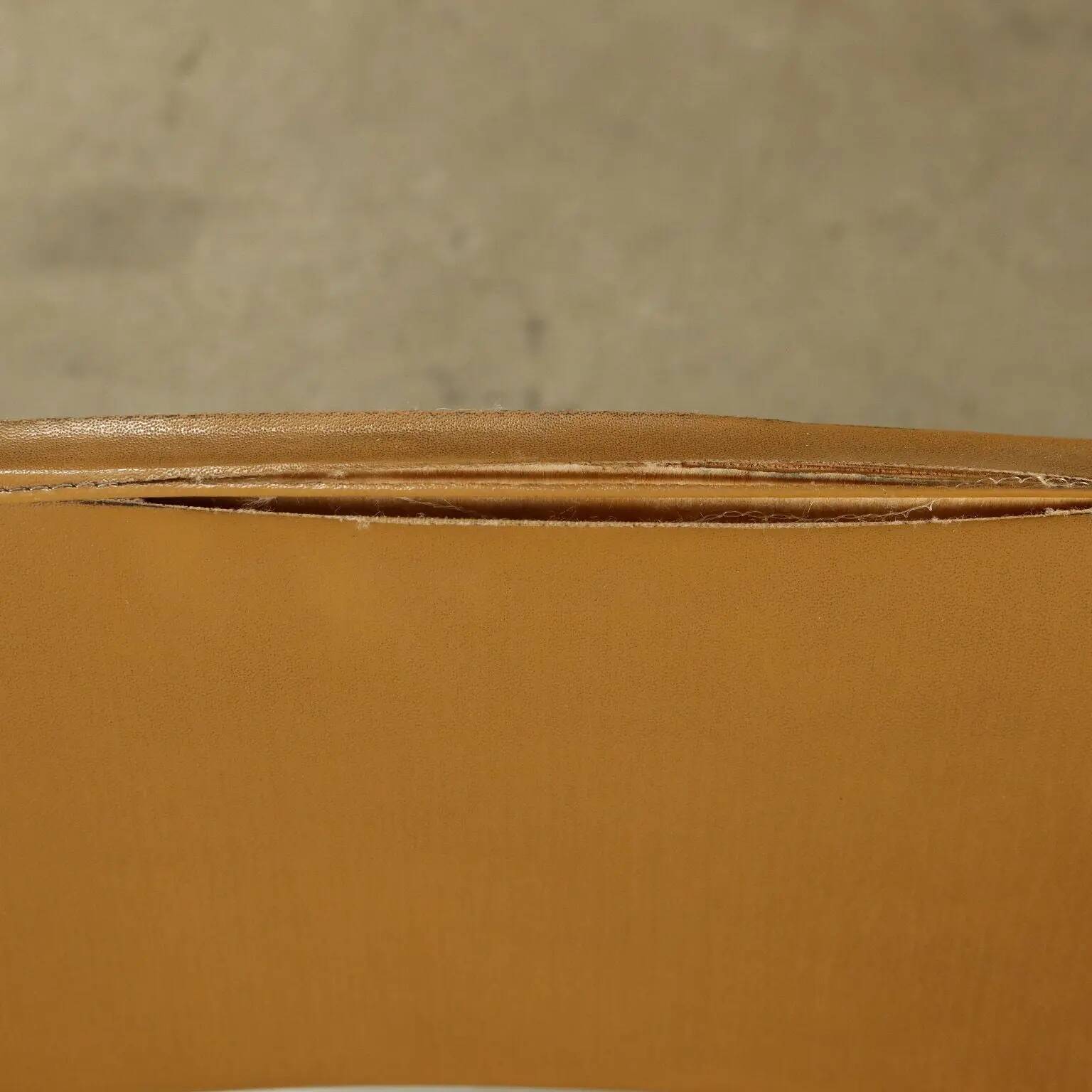 Vintage chairs from the 1960s in enamelled metal, faux leather and foam.
