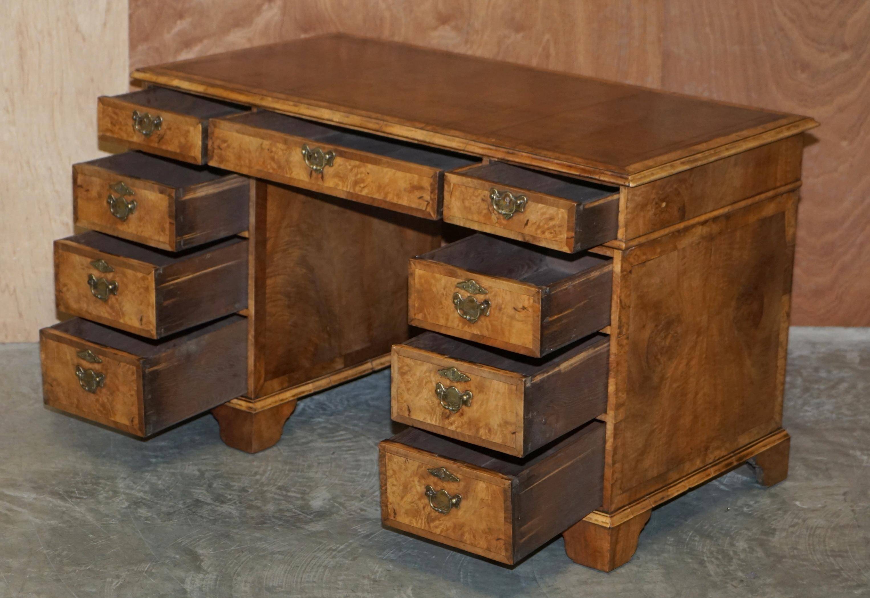 Antique Victorian desk with two pedestals in burr walnut and leather.