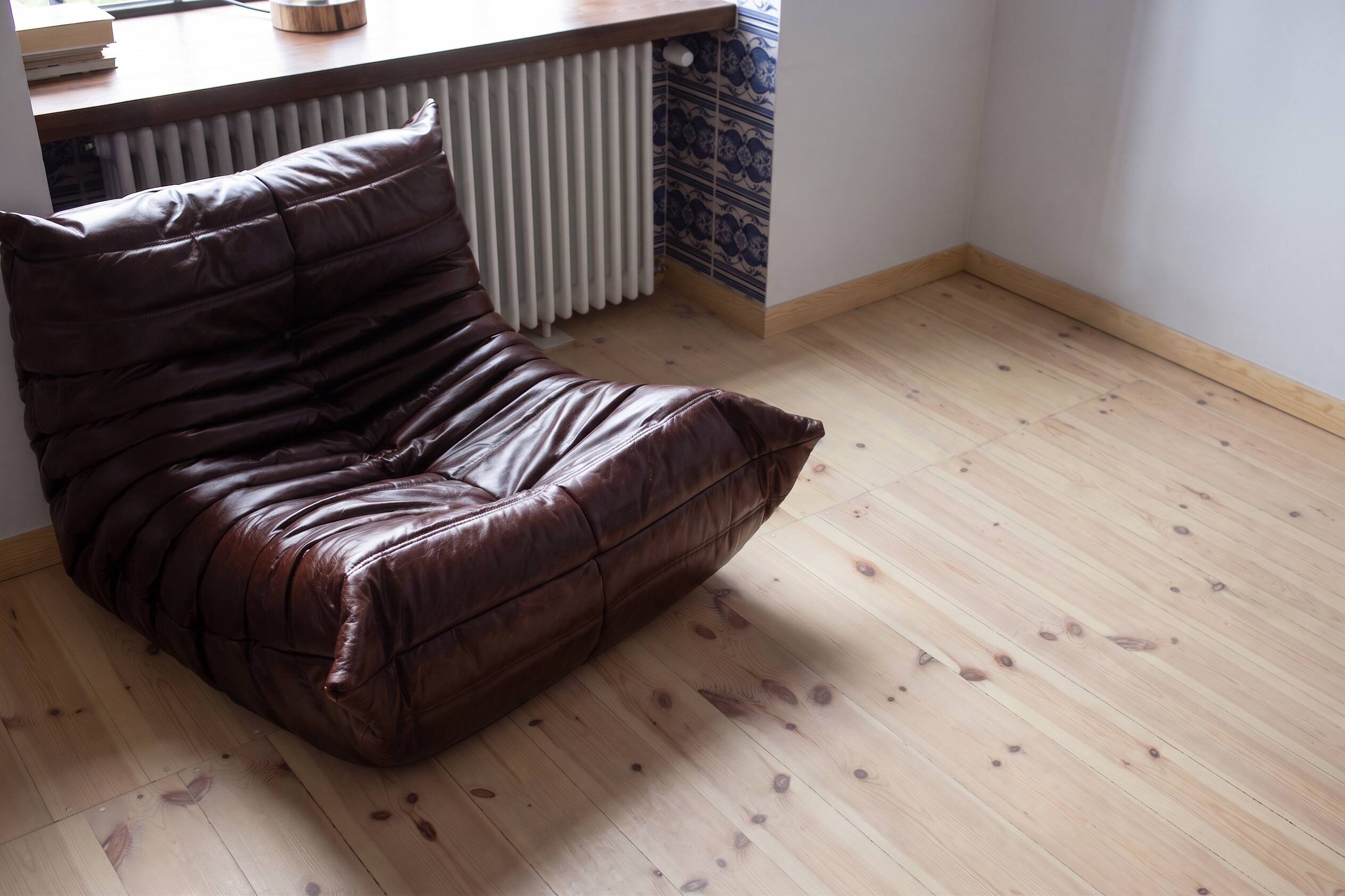 Togo armchair in dark brown shiny leather