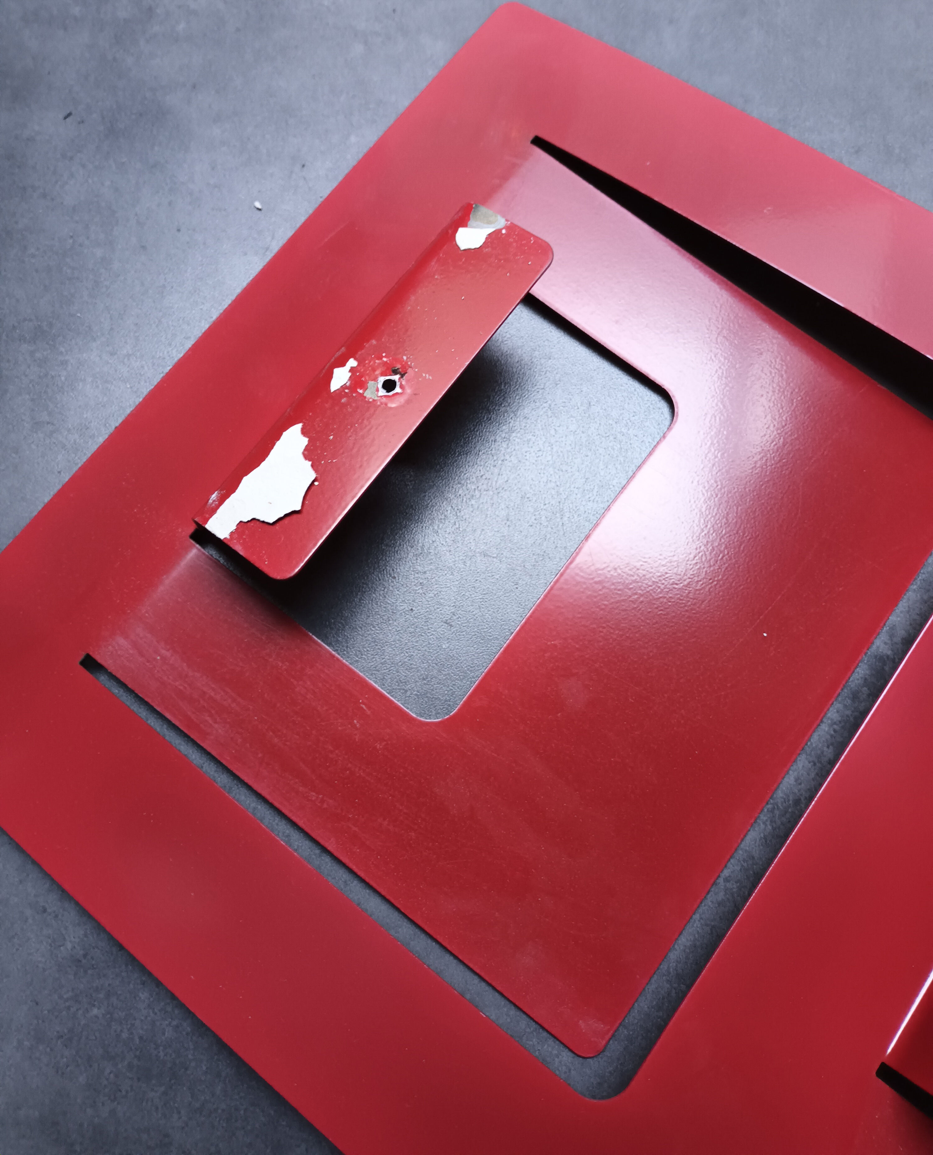 Vintage red metal wall magazine rack