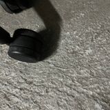 Vitra ID Trim office chair by Antonio Citterio — black mesh backrest and blue fabric seat, aluminium frame.