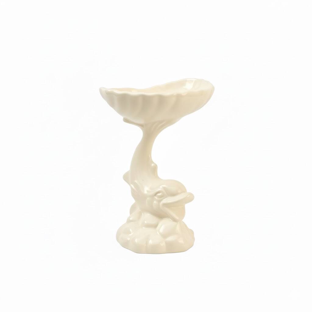 Dartmouth pottery koi carp supporting a shell-shaped dish/vase.