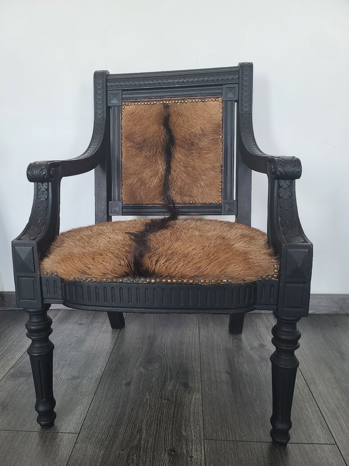 Character armchair in black wood and animal skin #CHMR