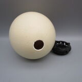 Ostrich egg on pedestal