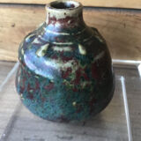 Small Dalpayrat vase shaped ball in polychrome glacured ceramic with relief decoration of a flower signed under the base