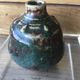 Small Dalpayrat vase shaped ball in polychrome glacured ceramic with relief decoration of a flower signed under the base