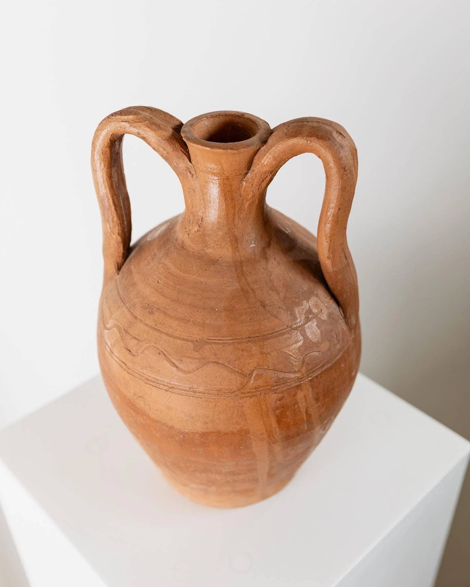 Vintage terracotta amphora vase from the early 19th century, handmade Italian jug with two handles.