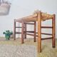 Old wooden and straw bench