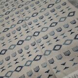 Handmade white and blue rug made of natural wool