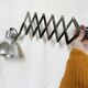 Vintage accordion wall light in chrome metal.
