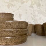 Set of stoneware coffee cups with saucers