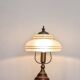 Vintage lamp made of turned wood, brass, and frosted glass.