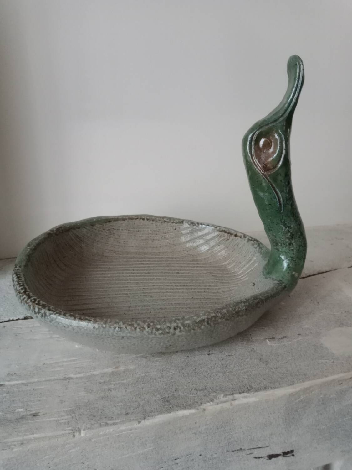 Empty pocket cup forming a bird