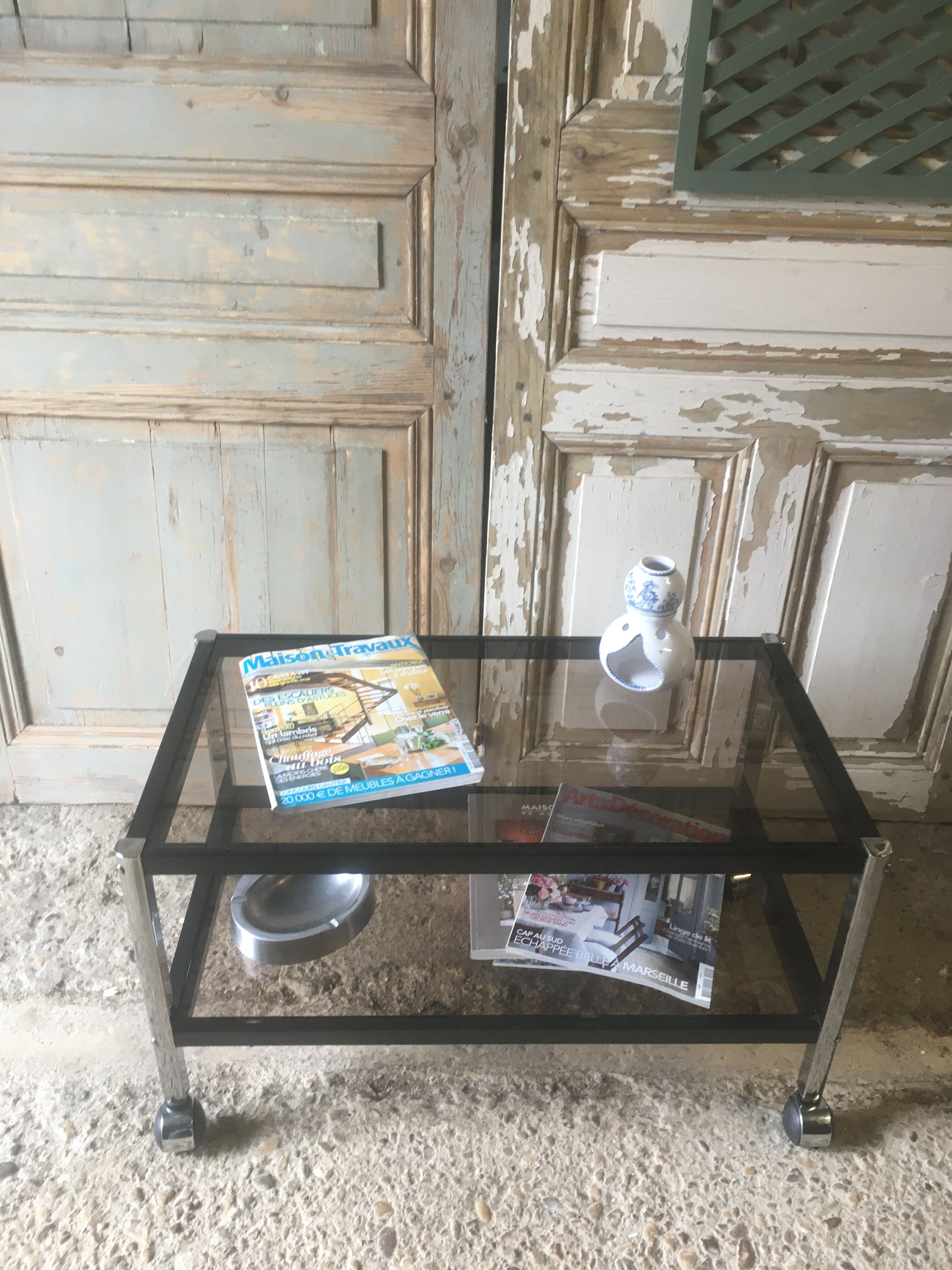 Metal coffee table with smoked glass.