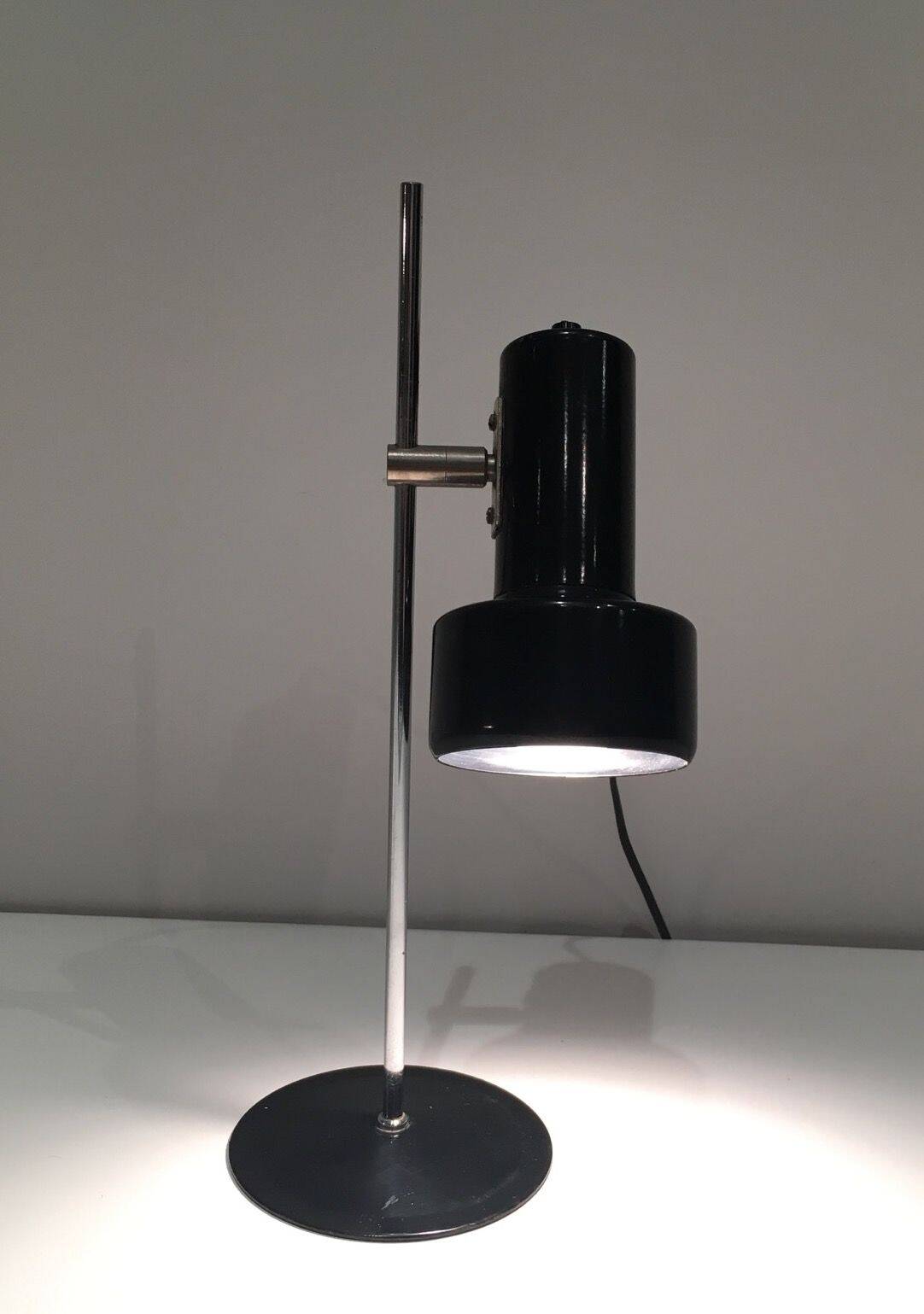 Adjustable lamp in black lacquered metal and chrome. French work. Circa 1970.