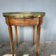 Hot water bottle table with a marble top and a brass gallery.