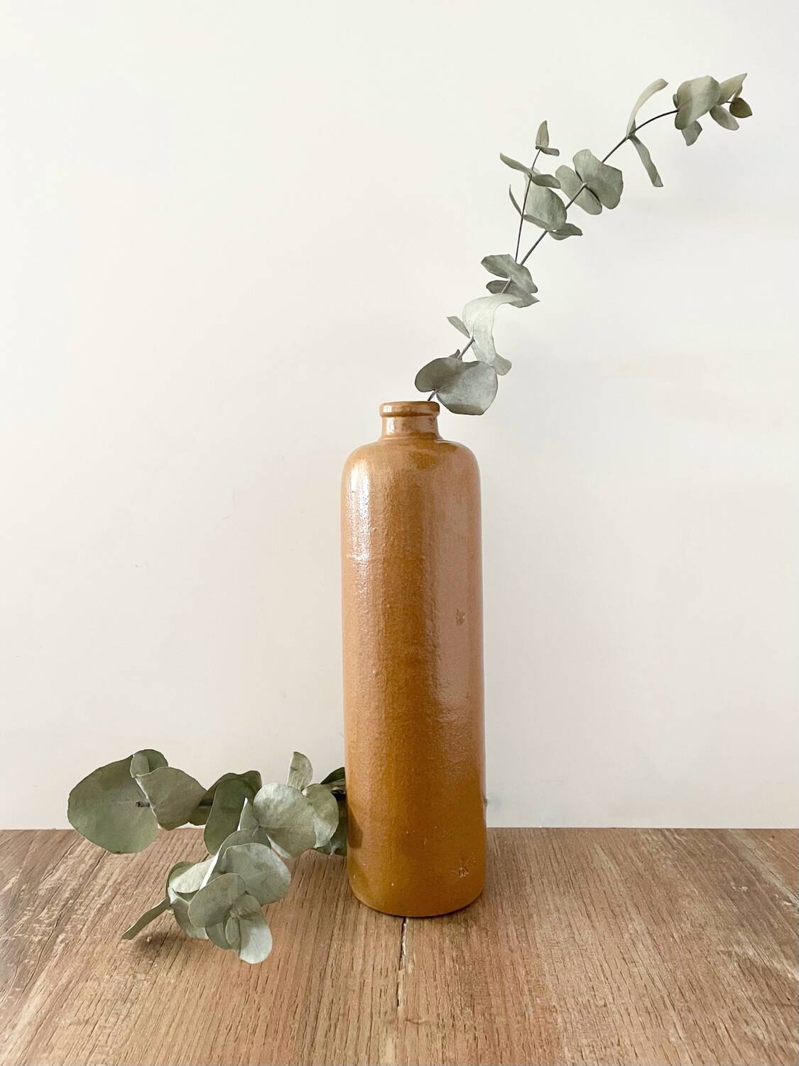 Old stoneware bottle with logo