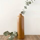 Old stoneware bottle with logo