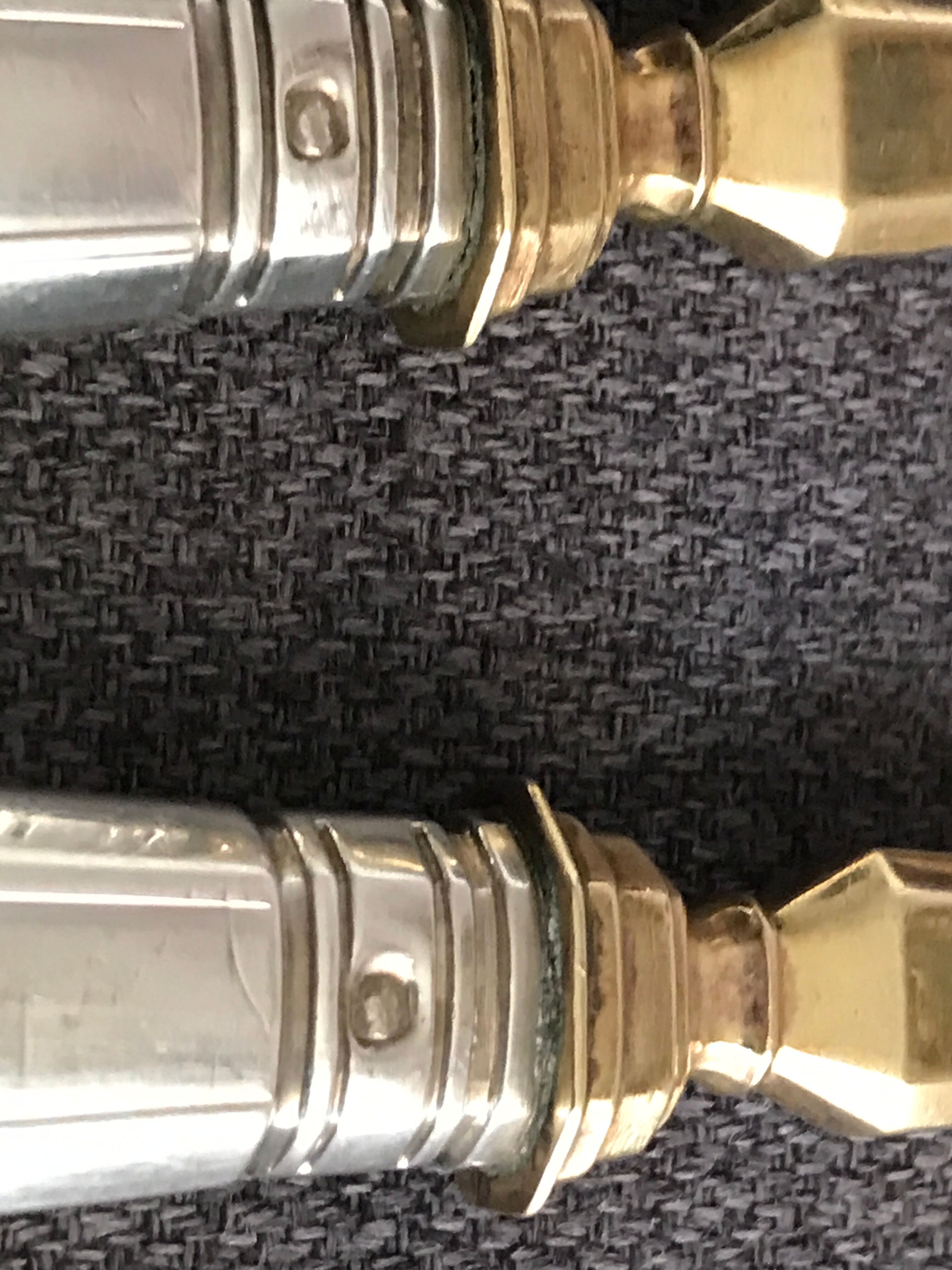 Pair of serving spoons in silver hallmark neck brace