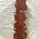 Decorative carved wooden ornament bouquet flowers and ribbon