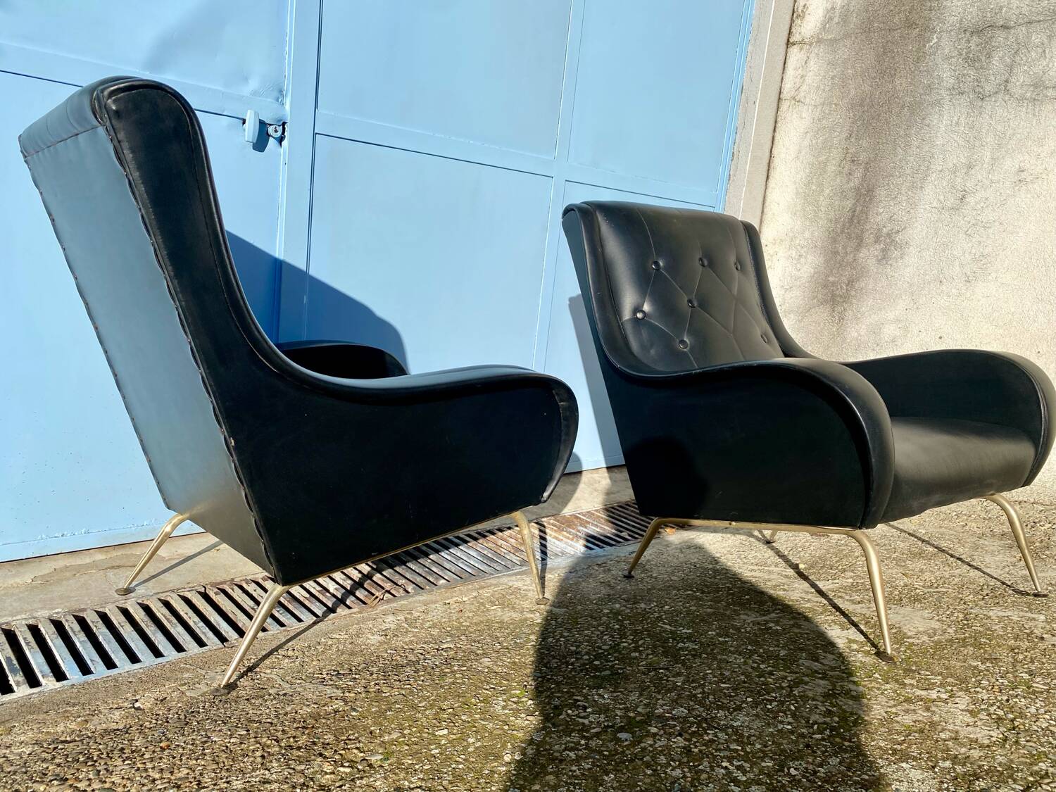 2 vintage faux leather armchairs