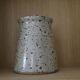 Pot with speckled sandstone lid