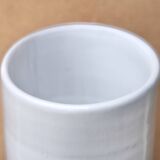Vase by Antonio Lampecco minimalist white ceramic scroll