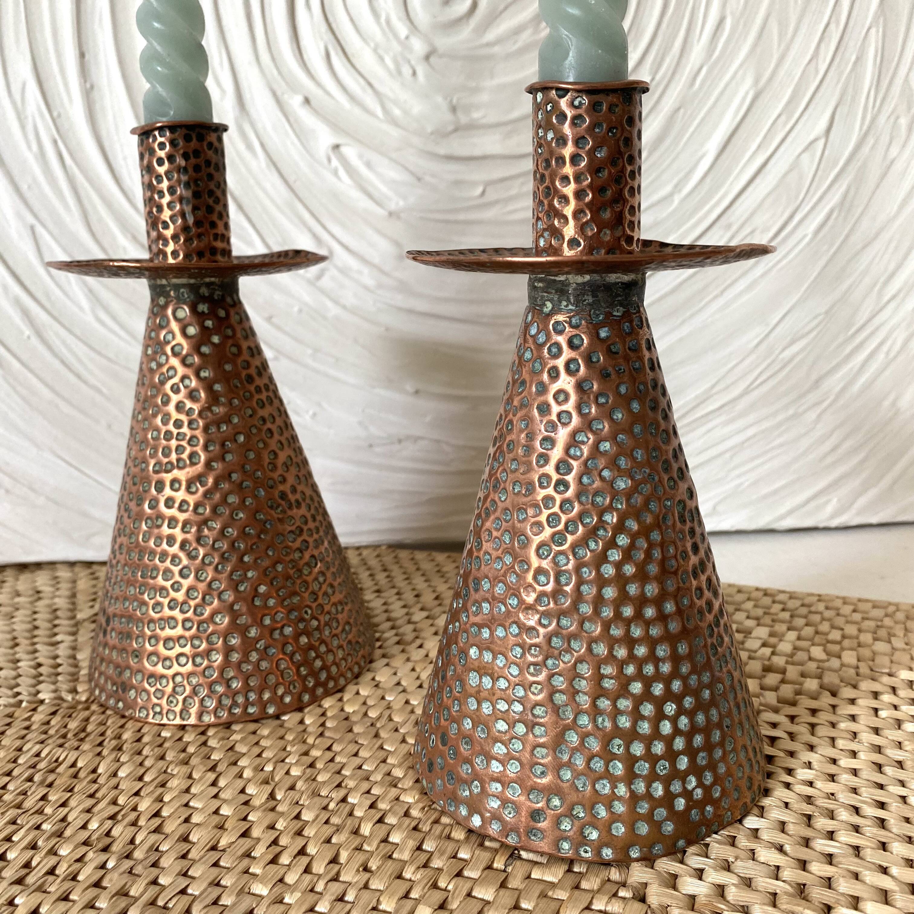 Pair of hammered copper candlesticks from the 1950s
