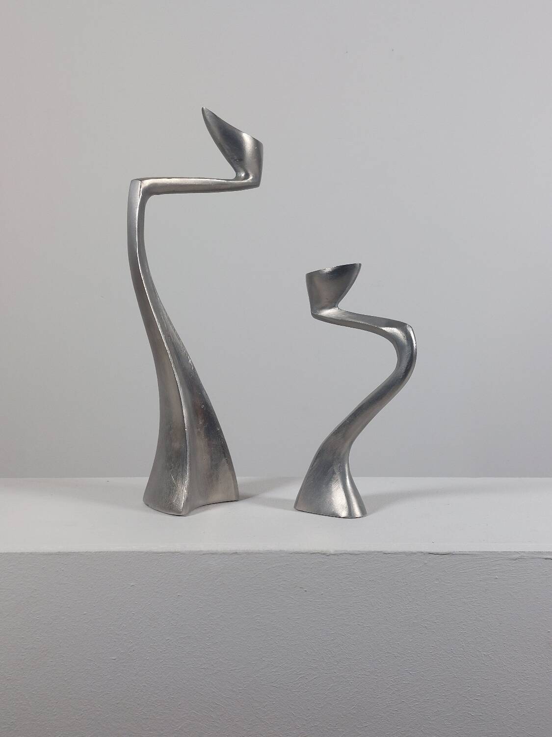 Pair of postmodern aluminium candlesticks by Matthew Hilton