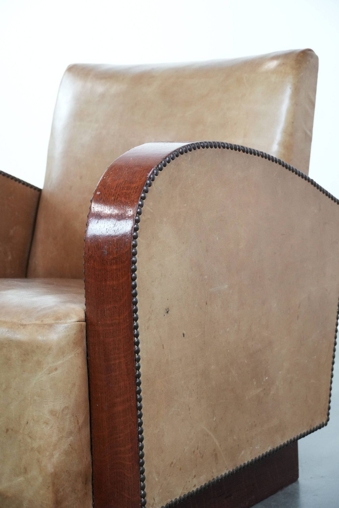 Art Deco design armchair in light cognac cowhide leather.