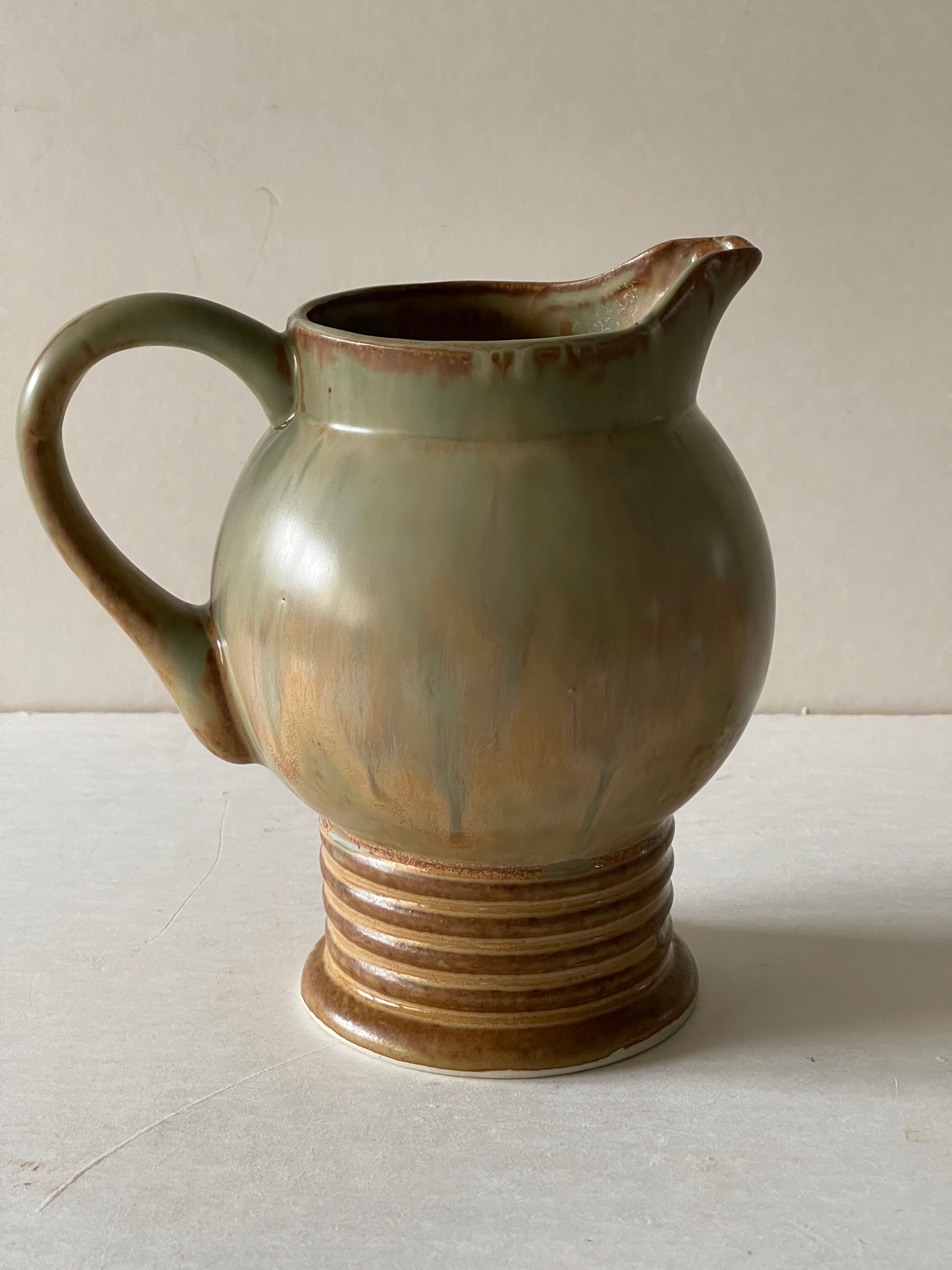 Pitcher in art deco sandstone
