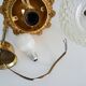 Brass and diamond-tipped chiseled glass globe hanging lamp