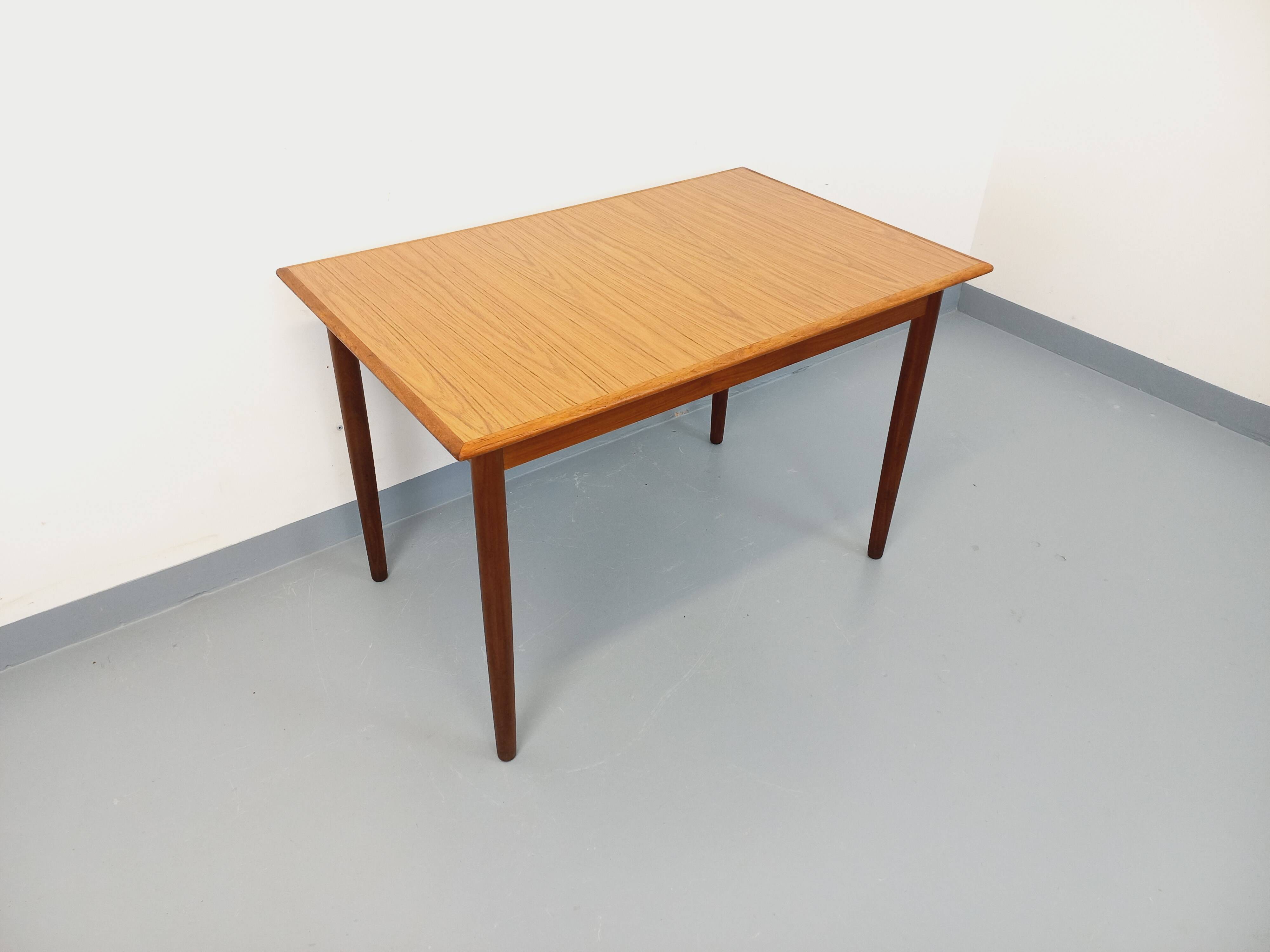 Rectangular dining table in vintage Scandinavian style made of teak and melamine.