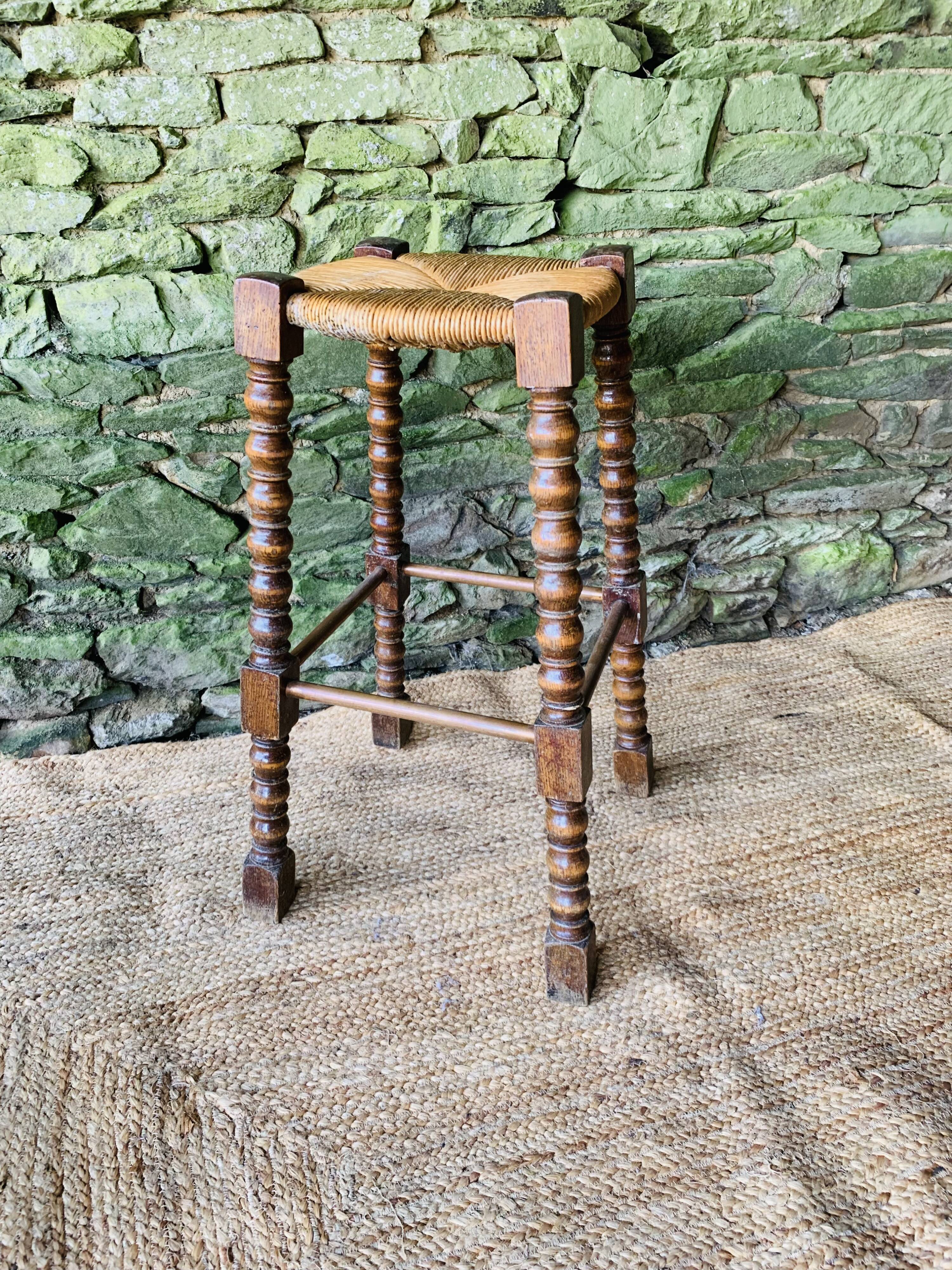 High stool in turned wood
