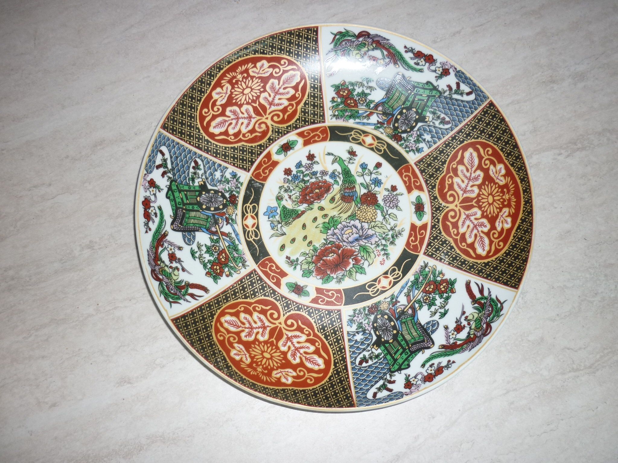 Chinese dish decorated with peacocks and plants
