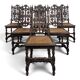 Set of 6 Henri II chairs in carved openwork oak with caned seats.