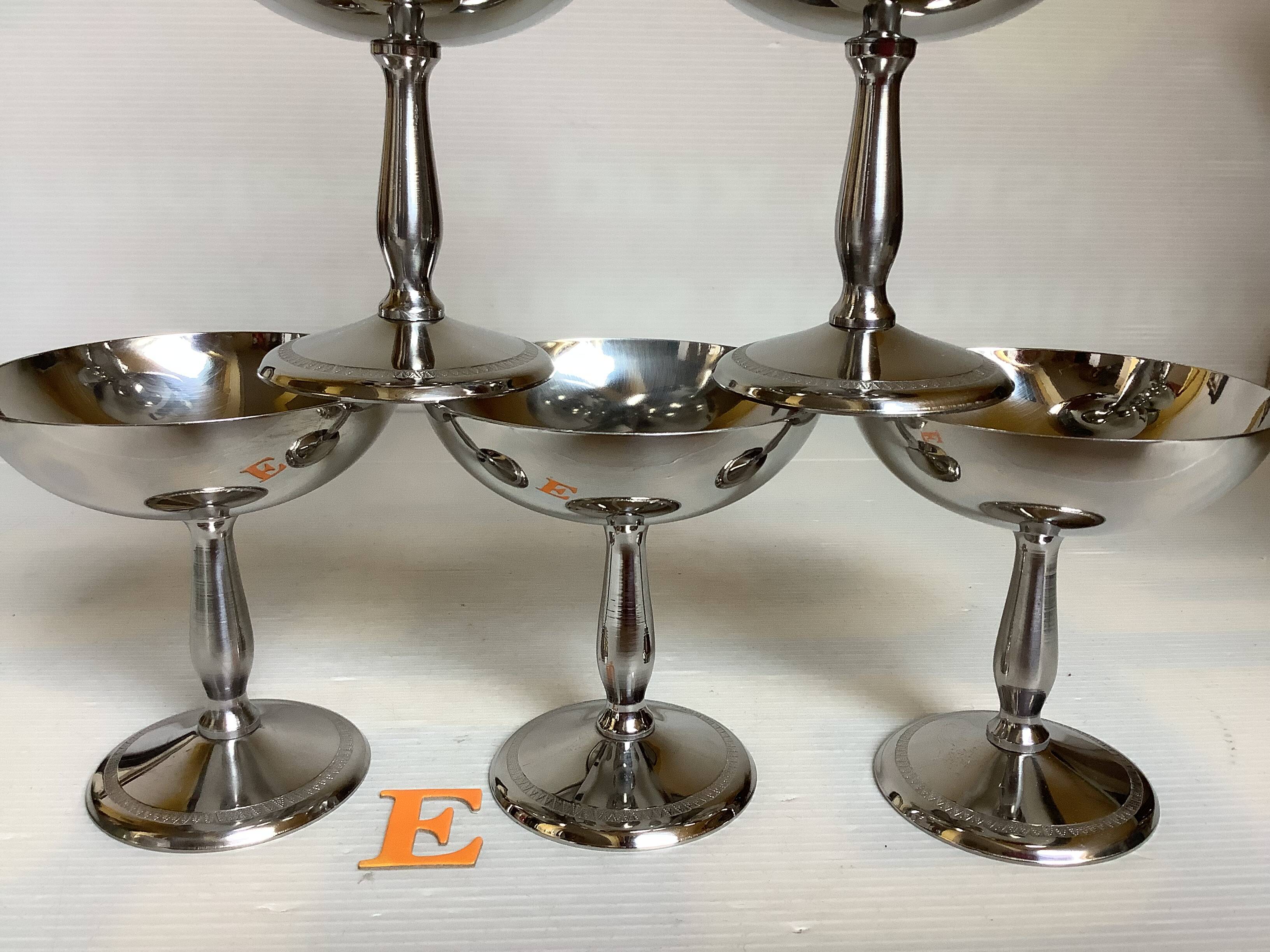 6 footed bowls with silver frieze in metal for ice.