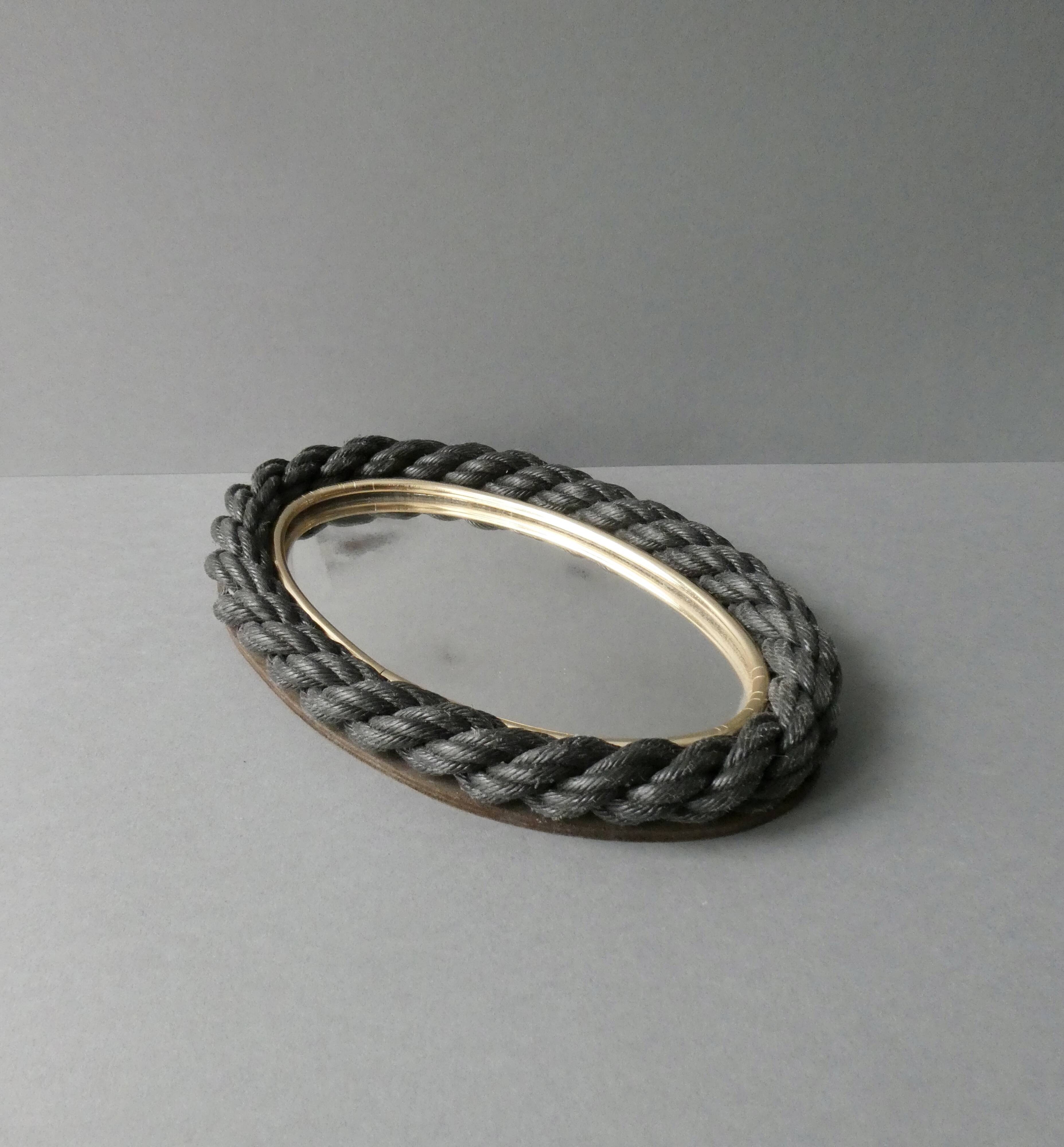 Oval mirror in black rope and gold edging, 1960s