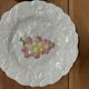 Set of 10 plates decorated with Sarreguemines porcelain fruit