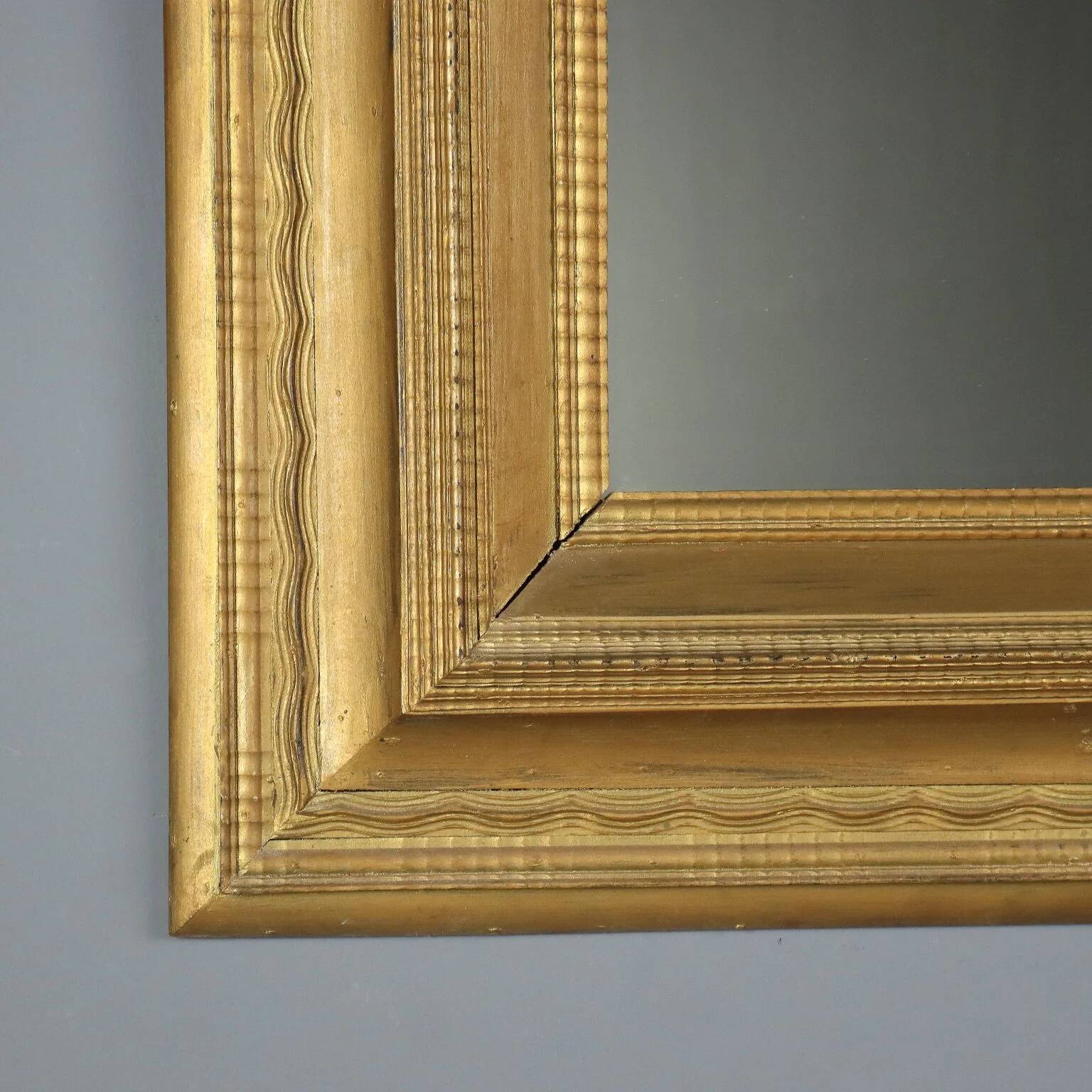 Antique gilded wooden mirror with guilloché frame, Italy, 19th century.