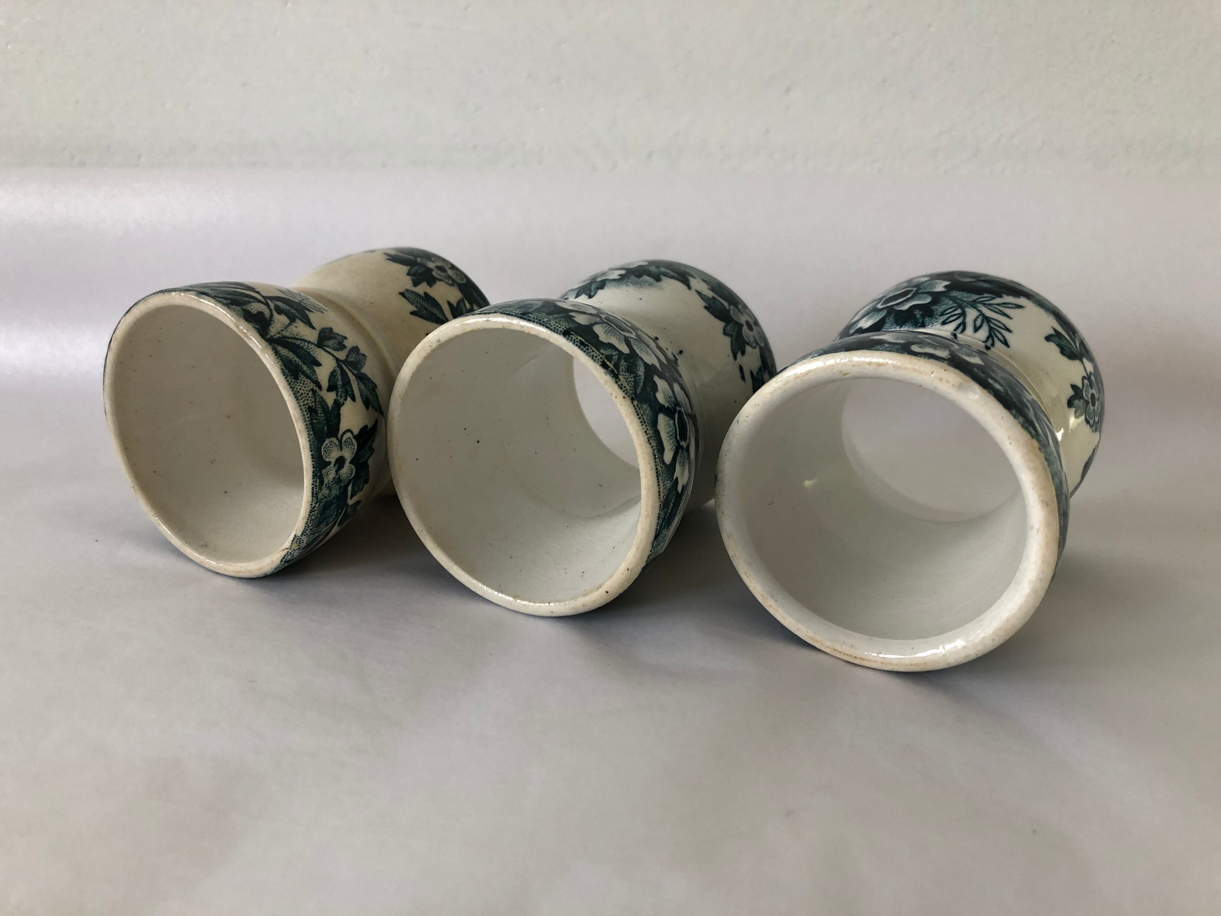 Trio of former egg cups earthenware
