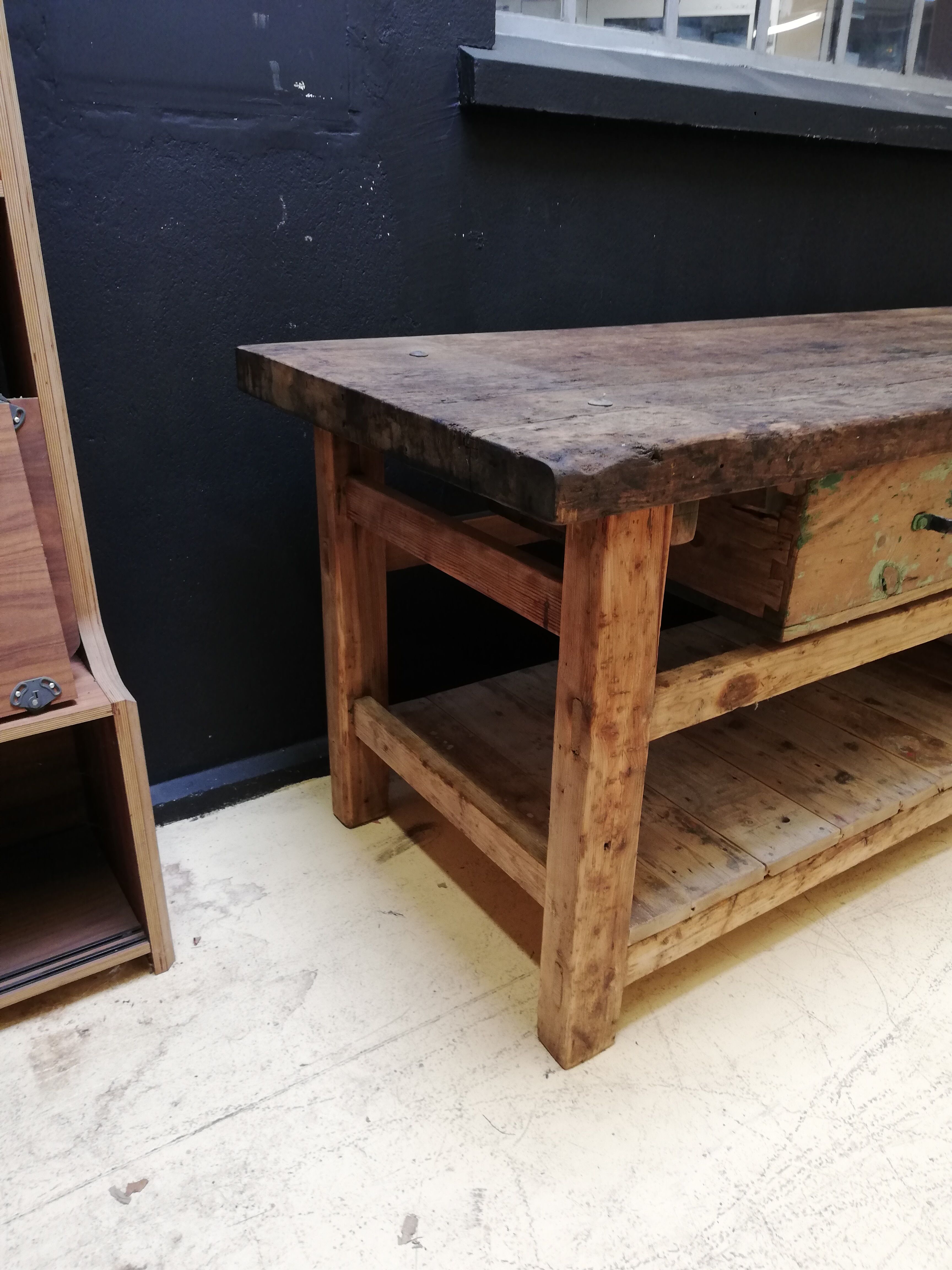 Old vintage wooden carpenter's workbench, industrial decoration