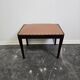 Vintage wooden ottoman from the 1940s with a silk top and studded trim.