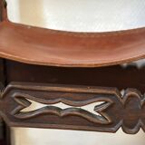 Frailero armchair, antique Spanish — carved wood & full-grain leather.