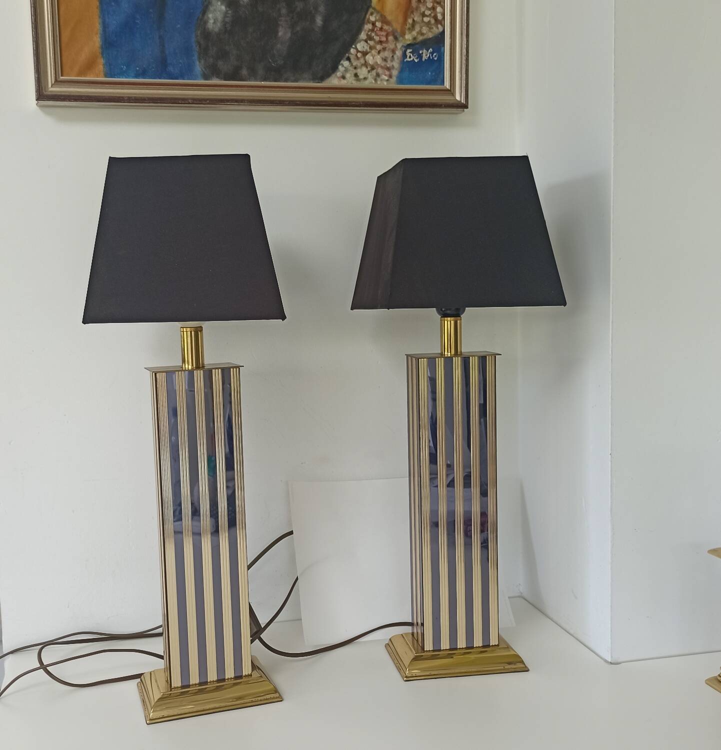 Pair of black and gold art deco style lamps