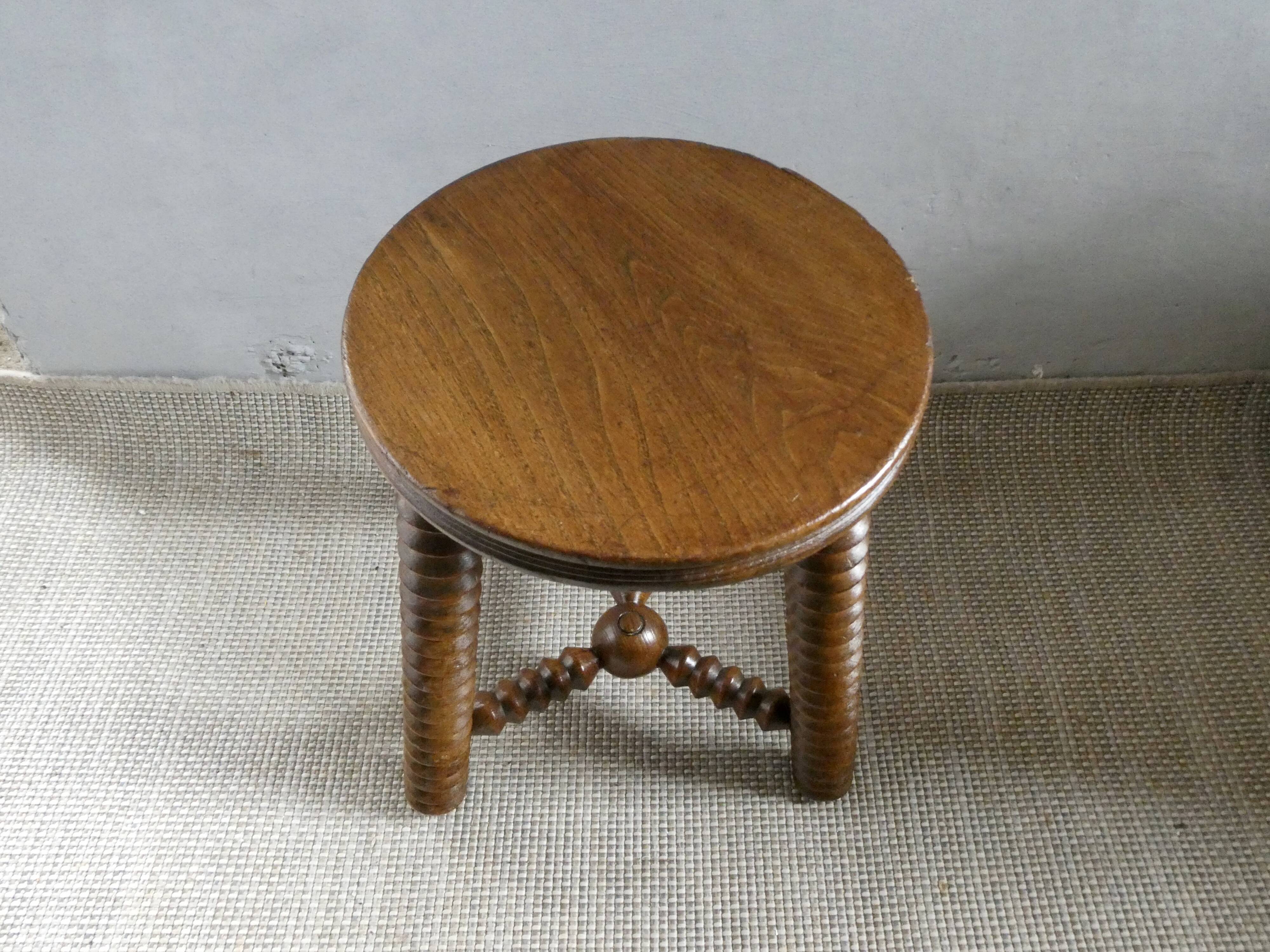 Tripod stool, with carved legs, around 1940