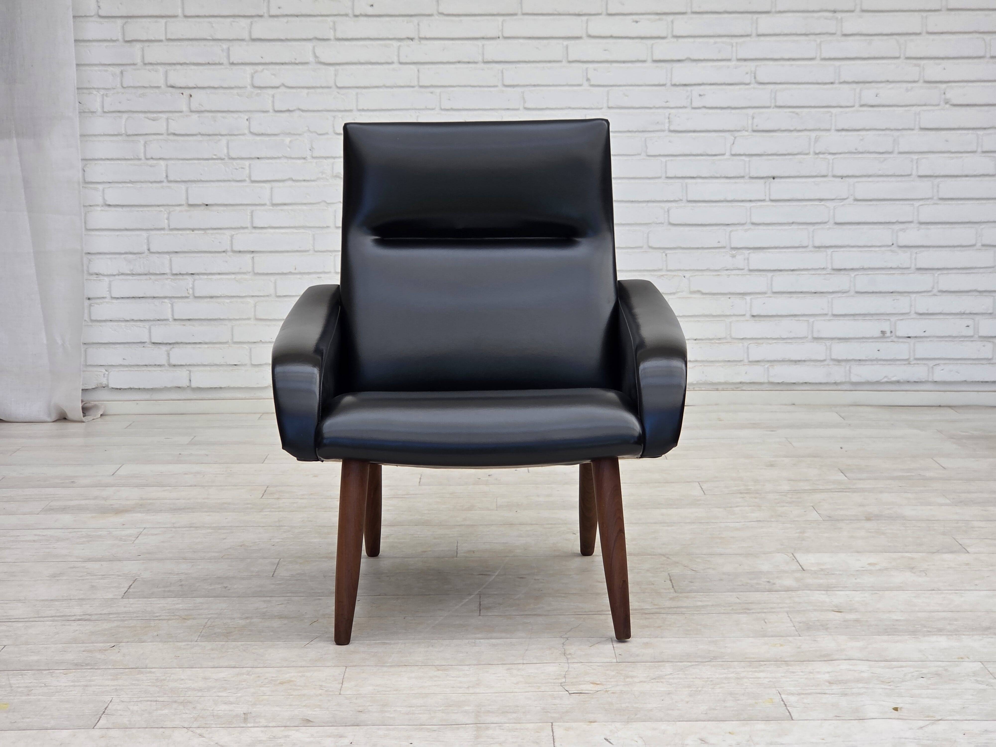 1970s, Danish armchair, black artificial leather, teak wood legs.