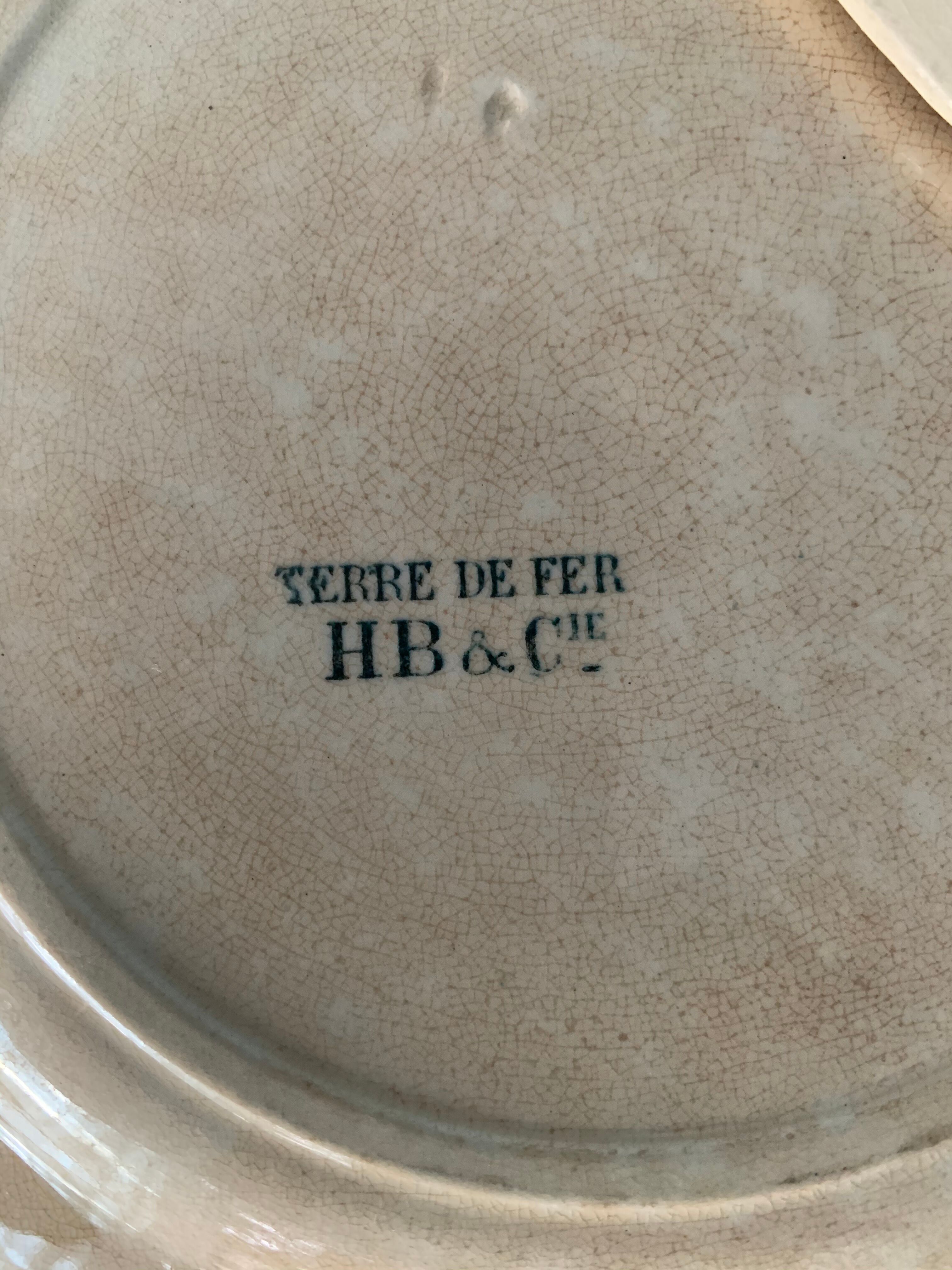 8 plates and an old compoter Terre de Fer HB and Co.